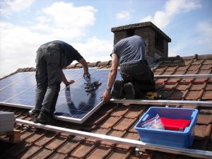 Installing solar panels on residential roof